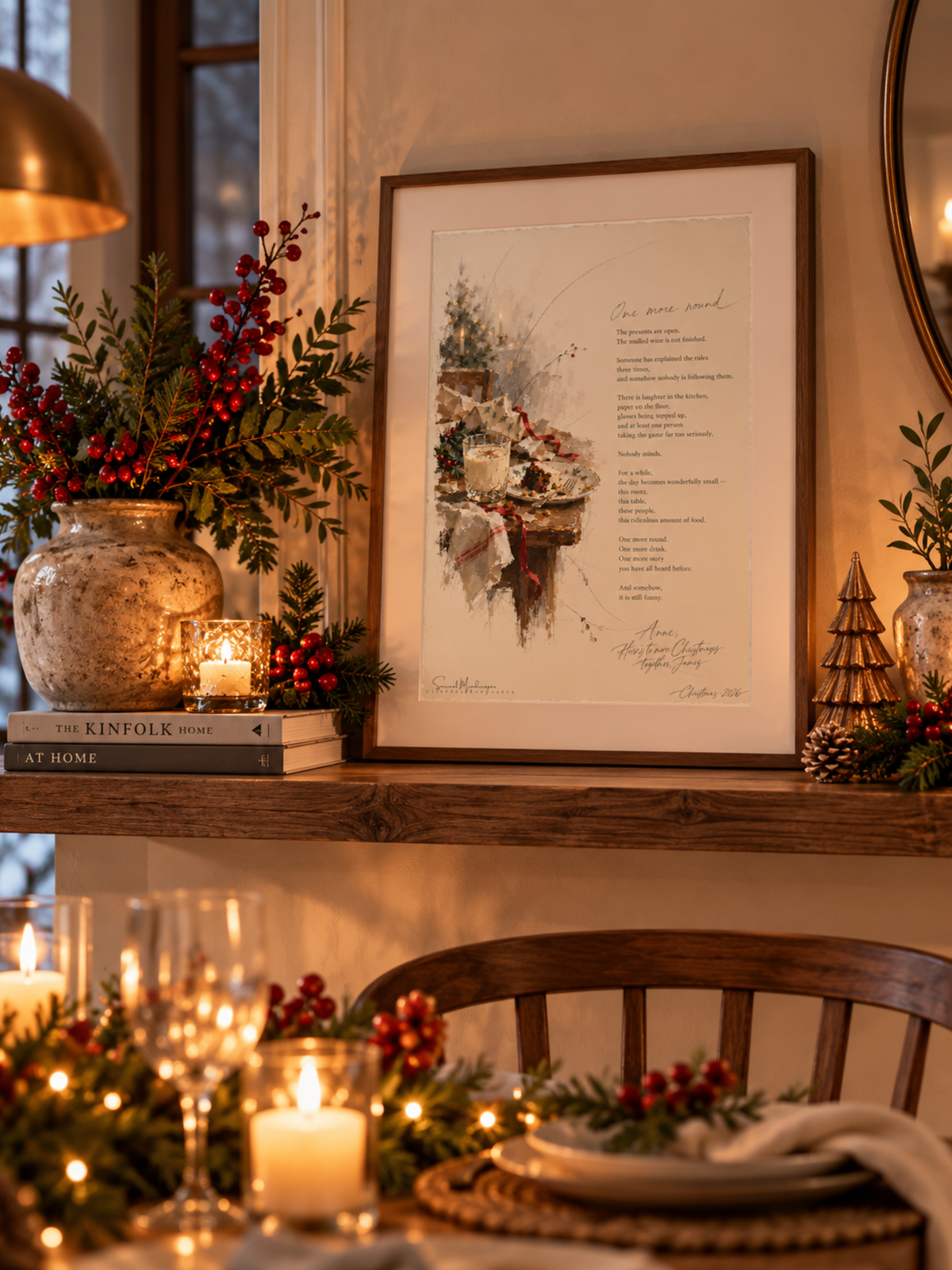One More Round framed Christmas poetry print displayed on a wooden mantelpiece with festive greenery, candles and warm Christmas lights.