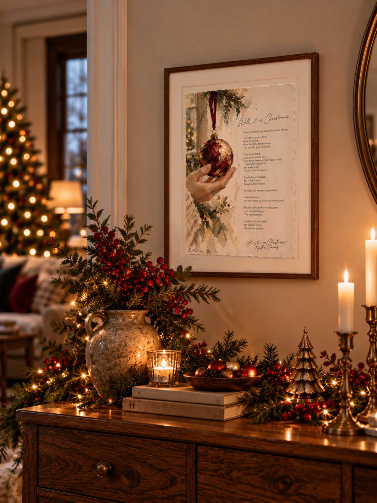 Well, It Is Christmas framed Christmas Fine Art print hanging on a wall above a wooden console with festive greenery, candles and warm seasonal lighting.